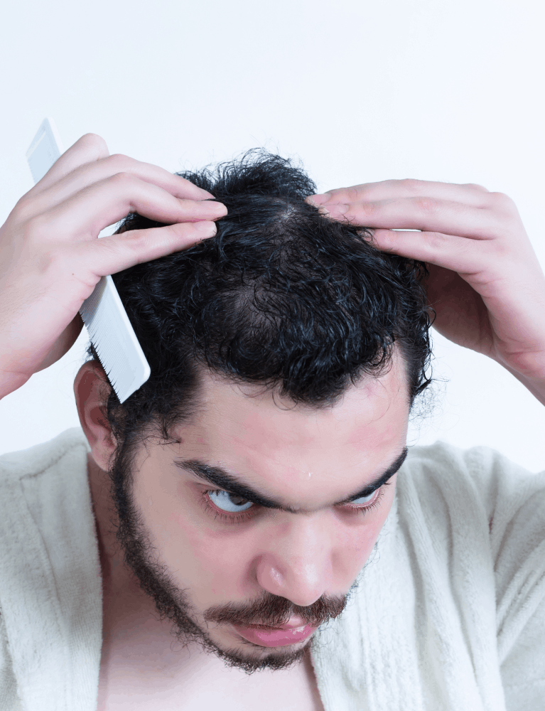 Dermatologist providing hair fall treatment to a patient experiencing hair loss at a skin and hair clinic in Chennai.