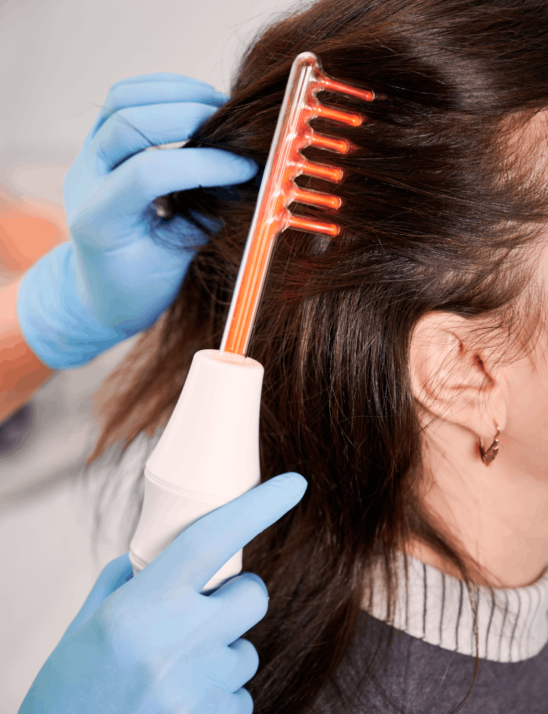 Dermatologist performing hair mesotherapy treatment on a patient experiencing hair loss at a skin and hair clinic in Chennai.