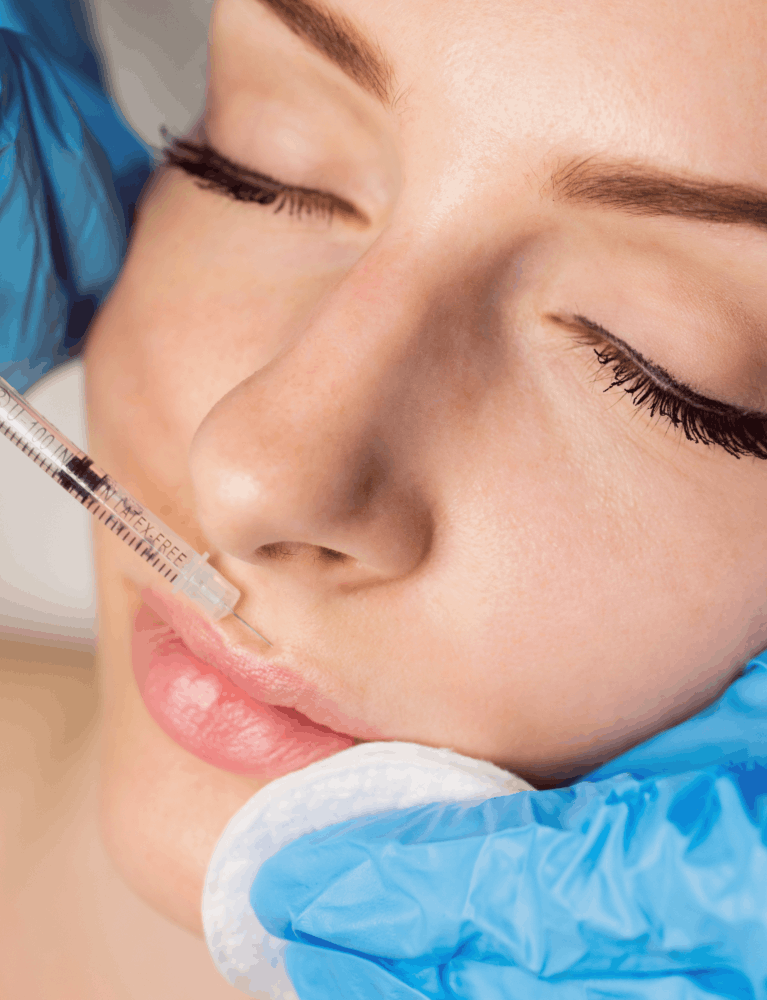Dermatologist performing lip blush treatment on a patient to enhance natural lip colour at a skin clinic in Chennai.