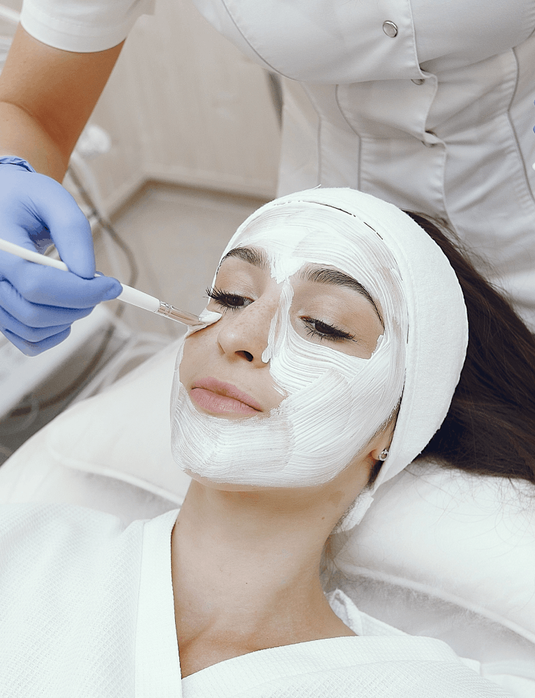 Dermatologist performing a chemical peel treatment on a patient at a skin clinic in Chennai.
