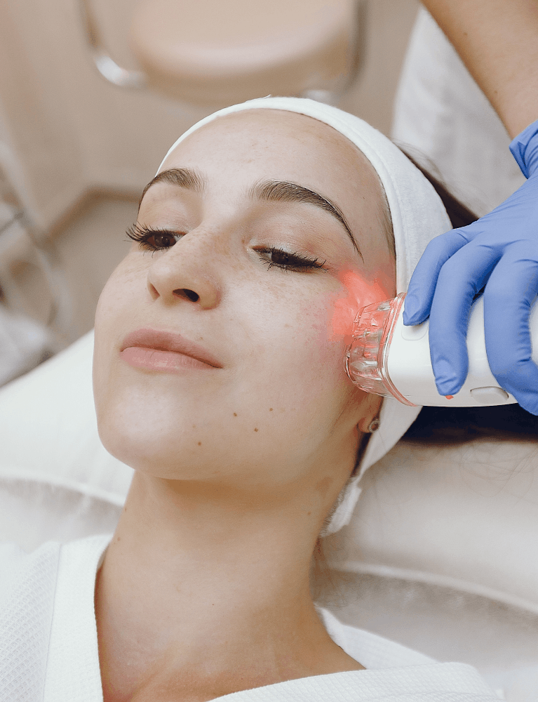 Dermatologist performing a CO2 laser procedure on a patient at a skin clinic in Chennai.
