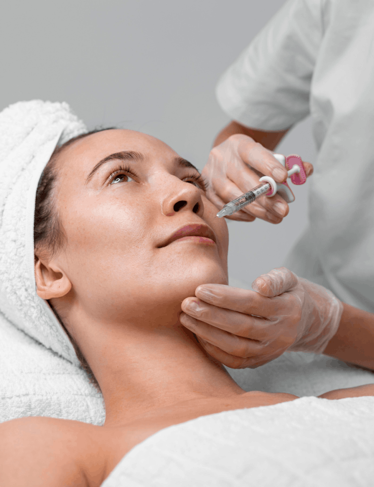 Dermatologist performing cold plasma treatment on a patient at a skin clinic in Chennai.