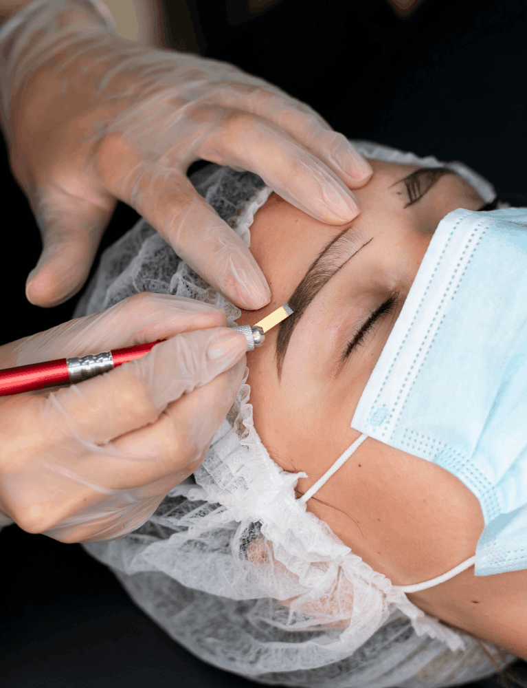 Specialist performing combination brows treatment on a client to create fuller and natural-looking eyebrows in Chennai.