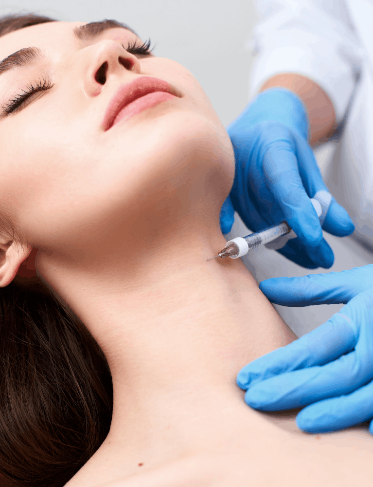 Dermatologist performing neck rejuvenation treatment on a patient at a skin clinic in Chennai.