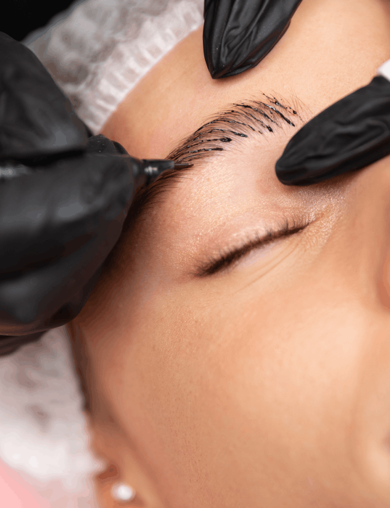 Specialist performing ombre brows treatment on a client to create soft, gradient-effect eyebrows in Chennai.
